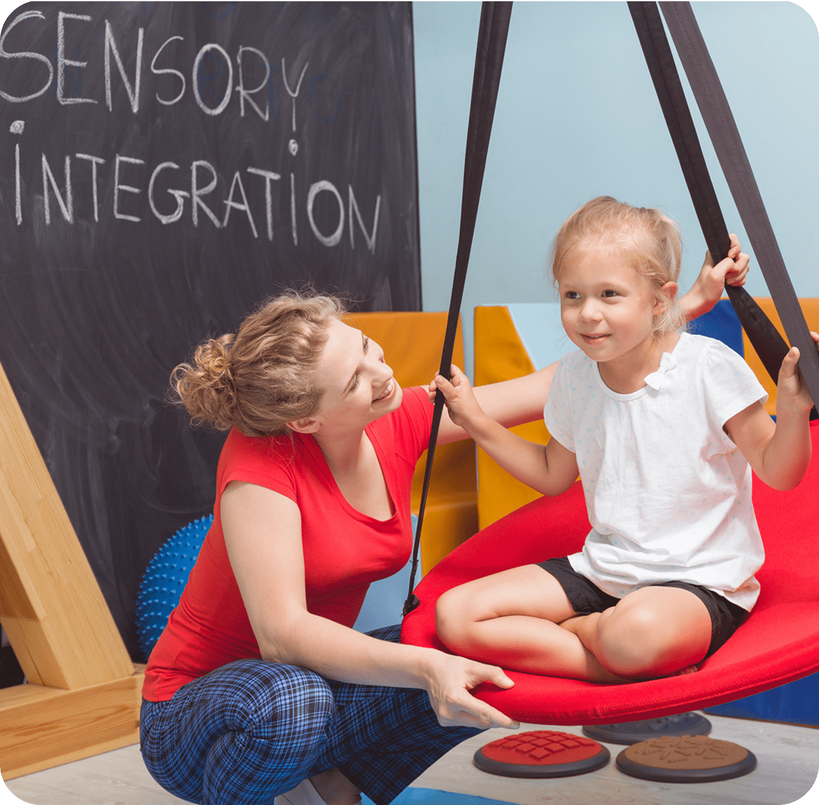Sensory exercise with child and instructor